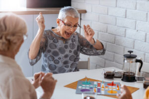 Three women playing boardgames.