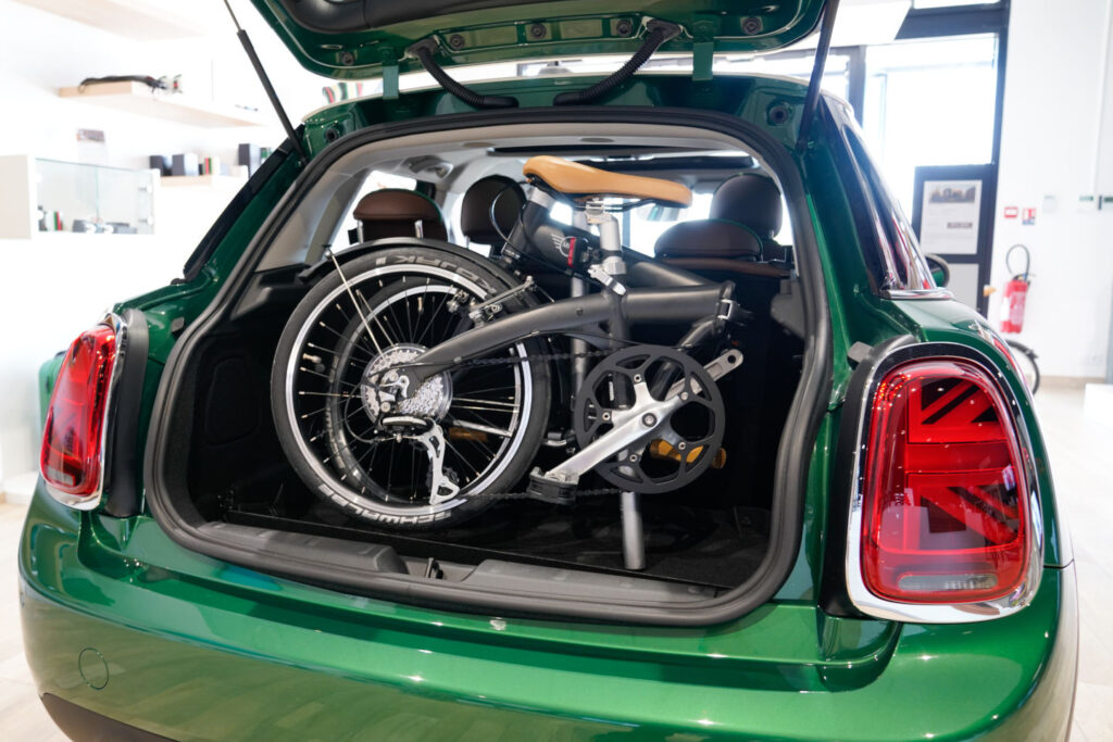 Bordeaux , Aquitaine / France - 10 15 2019 : bicycle in mini folding bike in trunk of the car